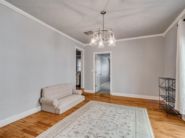 531 NW 48th St, Oklahoma City, OK 73118 - living area with a chandelier, wood finished floors, and crown molding