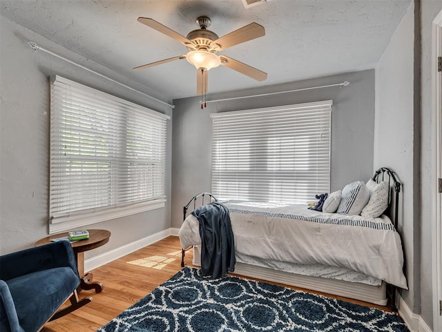 531 NW 48th St, Oklahoma City, OK 73118 - bedroom with wood finished floors and ceiling fan