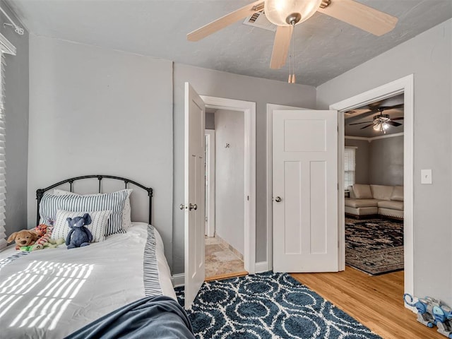 531 NW 48th St, Oklahoma City, OK 73118 - bedroom with wood finished floors and ceiling fan