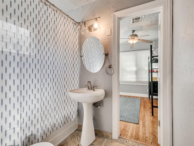 531 NW 48th St, Oklahoma City, OK 73118 - bathroom with ceiling fan and wood finished floors