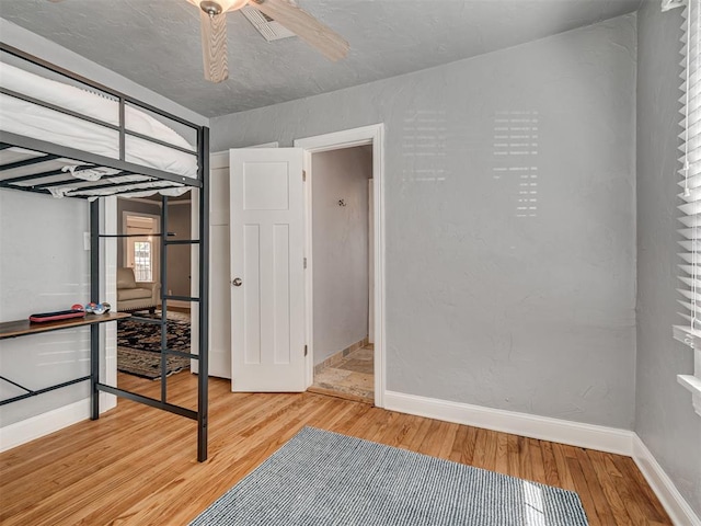 531 NW 48th St, Oklahoma City, OK 73118 - unfurnished bedroom featuring light wood finished floors and ceiling fan
