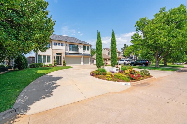 1415 Sherwood Ln, Nichols Hills, OK 73116 - view of front of house featuring driveway, an attached garage, a front yard, and stucco siding