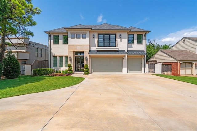 1415 Sherwood Ln, Nichols Hills, OK 73116 - view of front facade featuring an attached garage, a standing seam roof, driveway, stucco siding, and a metal roof