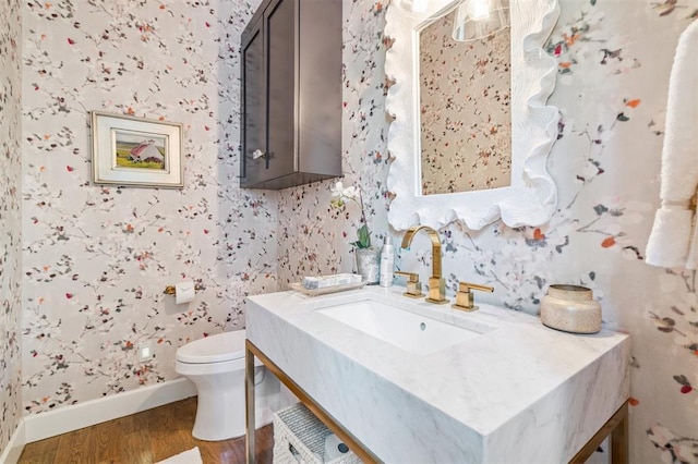 1415 Sherwood Ln, Nichols Hills, OK 73116 - half bath with wallpapered walls, vanity, and wood finished floors