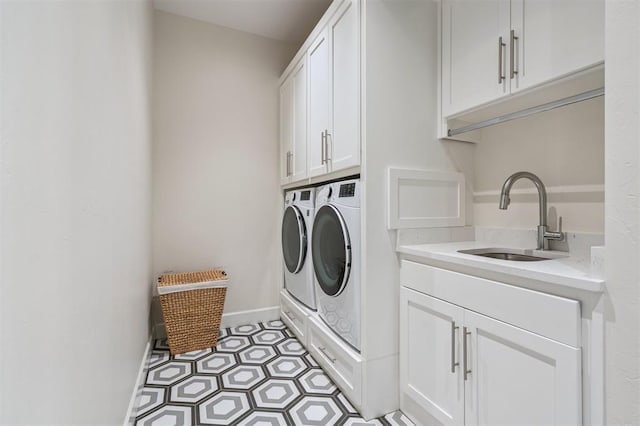 1415 Sherwood Ln, Nichols Hills, OK 73116 - laundry area with cabinet space and washing machine and clothes dryer