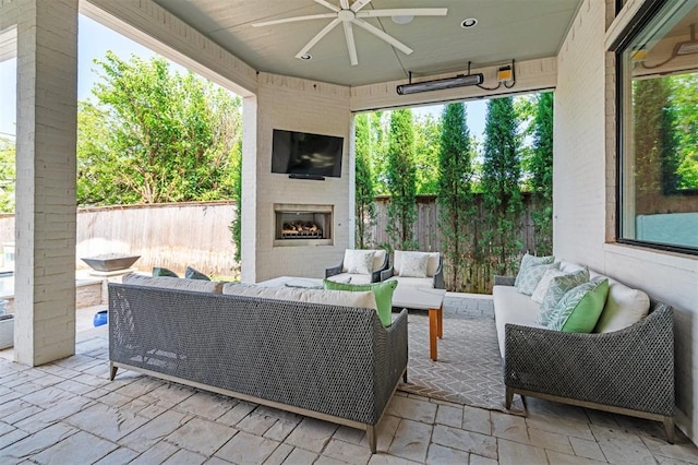 1415 Sherwood Ln, Nichols Hills, OK 73116 - view of patio / terrace with an outdoor living space with a fireplace and a ceiling fan