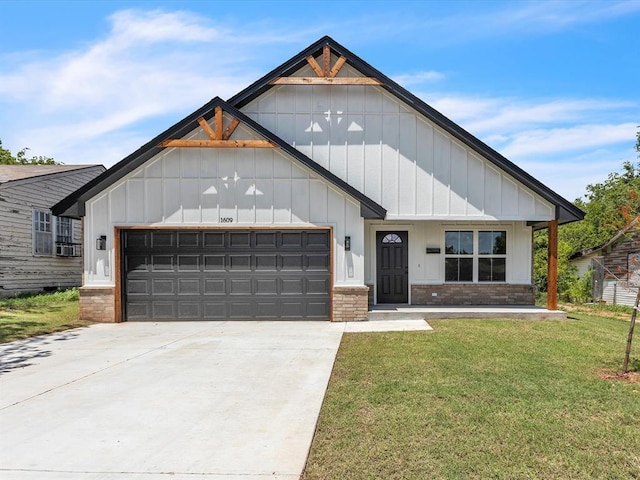 1609 NE 26th St, Oklahoma City, OK 73111 - modern farmhouse with board and batten siding, a front yard, concrete driveway, and brick siding