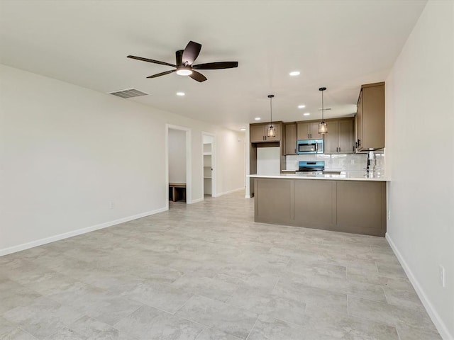 1609 NE 26th St, Oklahoma City, OK 73111 - kitchen featuring stainless steel microwave, recessed lighting, ceiling fan, range, and open floor plan