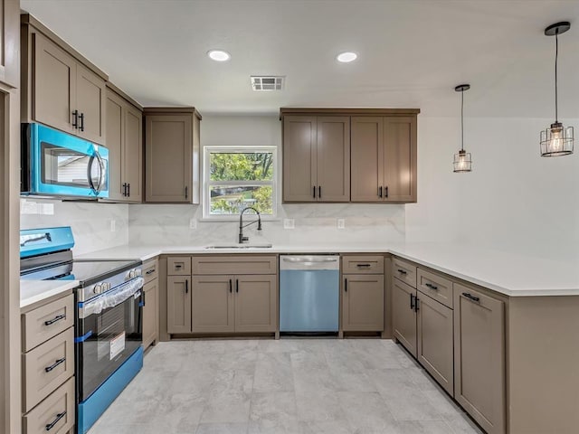 1609 NE 26th St, Oklahoma City, OK 73111 - kitchen with dishwasher, stainless steel range with electric cooktop, a peninsula, backsplash, and light countertops