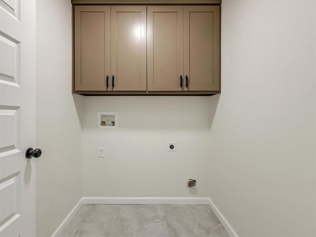 1609 NE 26th St, Oklahoma City, OK 73111 - washroom with electric dryer hookup, hookup for a washing machine, and cabinet space
