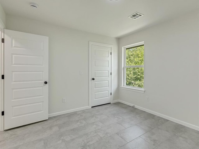 1609 NE 26th St, Oklahoma City, OK 73111 - spare room featuring a smoke detector and baseboards