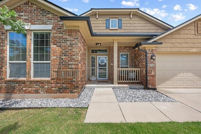 18200 Allora Dr, Edmond, OK 73012 - property entrance featuring brick siding, a porch, an attached garage, and concrete driveway