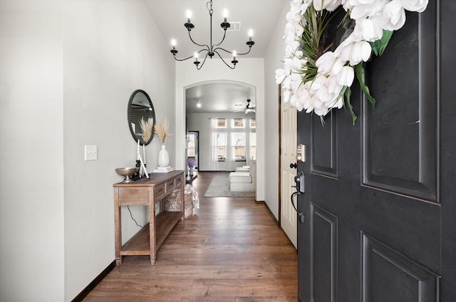 18200 Allora Dr, Edmond, OK 73012 - entrance foyer featuring arched walkways, a chandelier, and wood finished floors