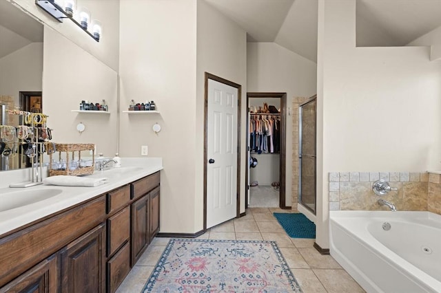 18200 Allora Dr, Edmond, OK 73012 - bathroom with vaulted ceiling, a shower stall, double vanity, a bath, and tile patterned flooring