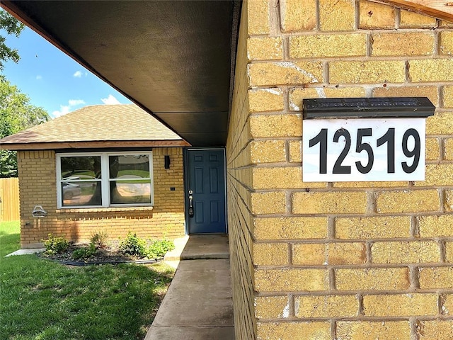 12519 SW 2nd St, Yukon, OK 73099 - doorway to property with brick siding and roof with shingles