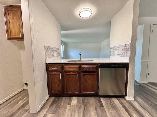 12519 SW 2nd St, Yukon, OK 73099 - bar area with dishwasher, wood finished floors, a textured wall, and decorative backsplash