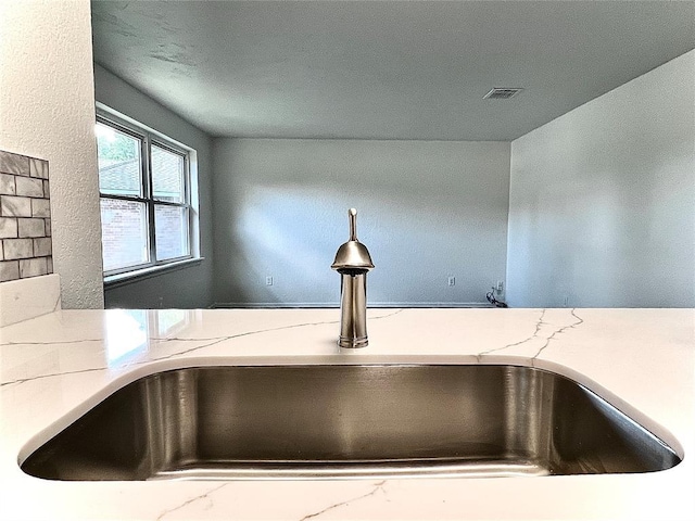 12519 SW 2nd St, Yukon, OK 73099 - kitchen view of a sink and light stone countertops