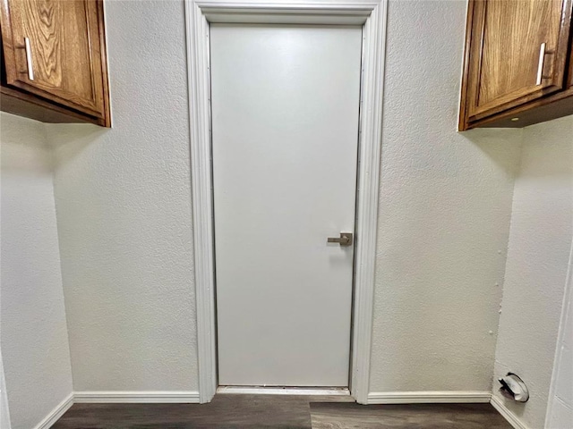 12519 SW 2nd St, Yukon, OK 73099 - laundry room featuring cabinet space and dark wood-type flooring