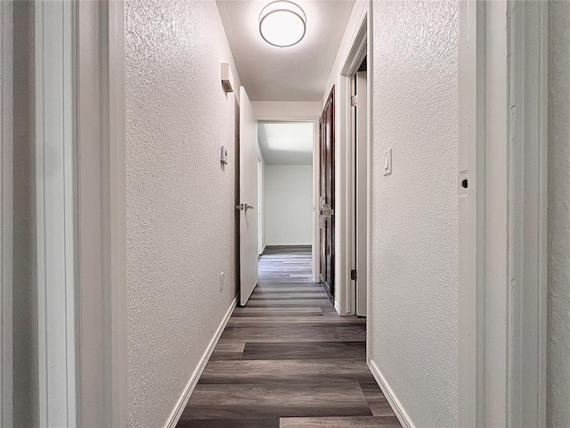 12519 SW 2nd St, Yukon, OK 73099 - hallway featuring a textured wall and wood finished floors