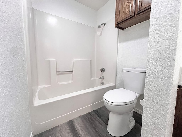 12519 SW 2nd St, Yukon, OK 73099 - bathroom featuring wood finished floors, a textured wall, and bathtub / shower combination