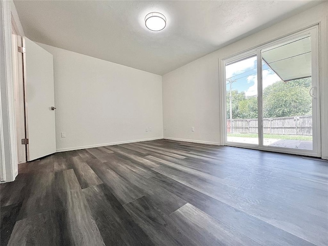 12519 SW 2nd St, Yukon, OK 73099 - empty room with dark wood-style floors and baseboards