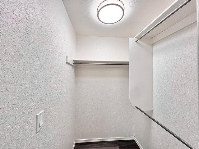 12519 SW 2nd St, Yukon, OK 73099 - spacious closet featuring dark wood finished floors