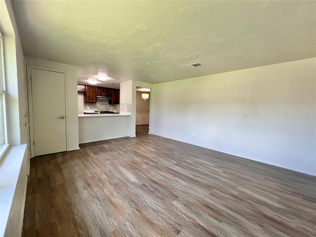 12517 SW 2nd St, Yukon, OK 73099 - unfurnished living room with dark wood-style floors