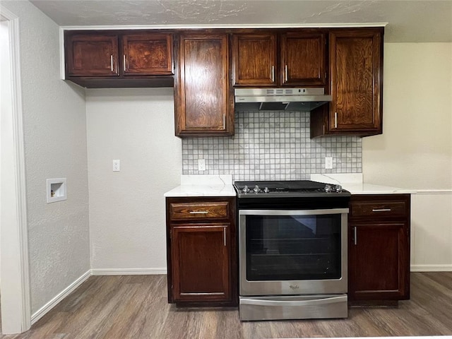 12517 SW 2nd St, Yukon, OK 73099 - kitchen featuring stainless steel stove, under cabinet range hood, wood finished floors, and decorative backsplash