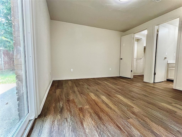 12517 SW 2nd St, Yukon, OK 73099 - spare room featuring wood finished floors and baseboards