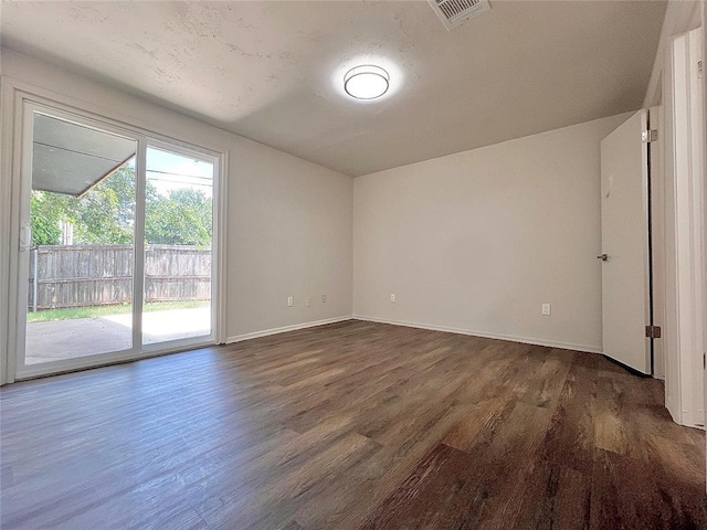 12517 SW 2nd St, Yukon, OK 73099 - unfurnished room featuring dark wood finished floors and baseboards