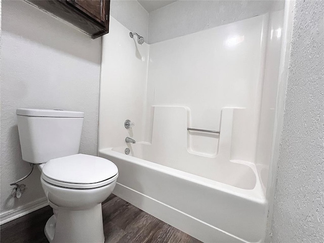 12517 SW 2nd St, Yukon, OK 73099 - bathroom featuring  shower combination and wood finished floors