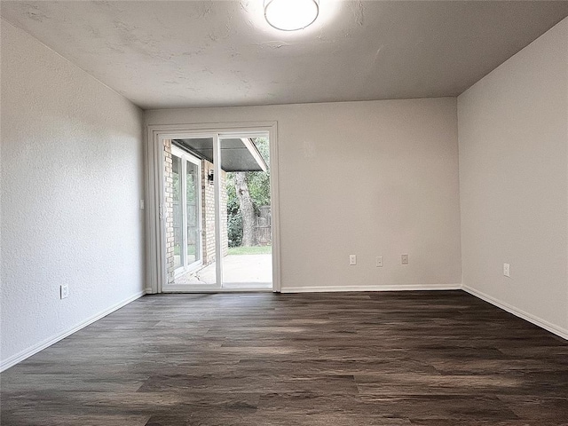 12517 SW 2nd St, Yukon, OK 73099 - empty room with dark wood-style flooring and baseboards