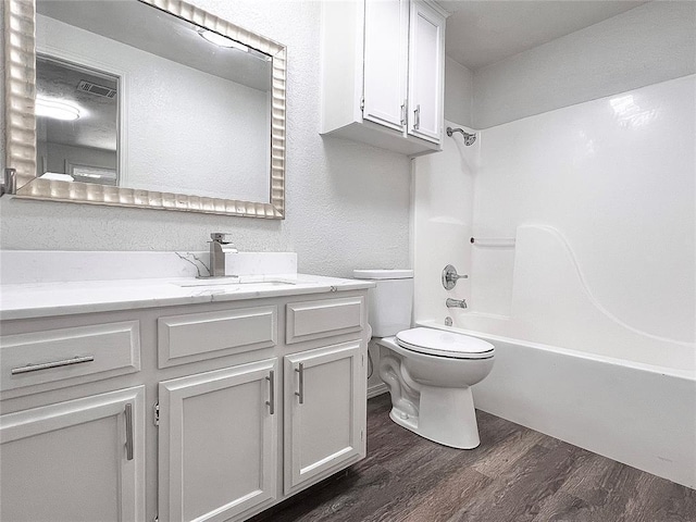 12517 SW 2nd St, Yukon, OK 73099 - full bath featuring vanity, wood finished floors, and shower / bath combination