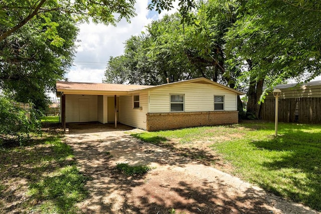 4025 Parkwoods Ln, Midwest City, OK 73110 - ranch-style house with a carport, concrete driveway, and brick siding