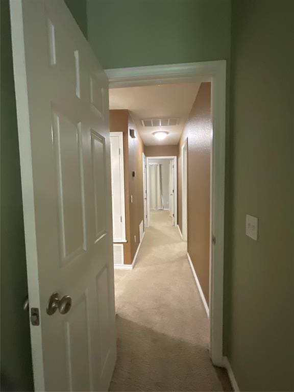 10201 Pinckney Ct, Oklahoma City, OK 73162 - hallway featuring light carpet and baseboards