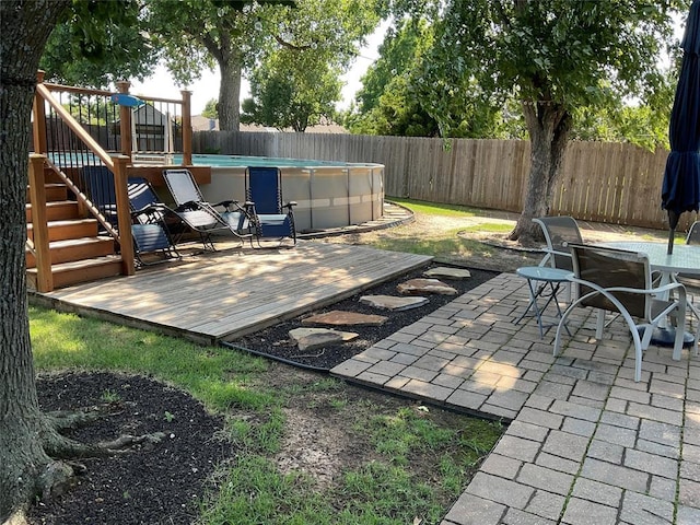 10201 Pinckney Ct, Oklahoma City, OK 73162 - fenced backyard featuring a deck and a patio