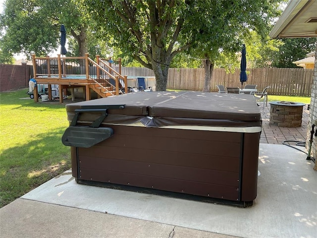 10201 Pinckney Ct, Oklahoma City, OK 73162 - fenced backyard featuring a hot tub, a fire pit, stairway, a patio area, and a wooden deck