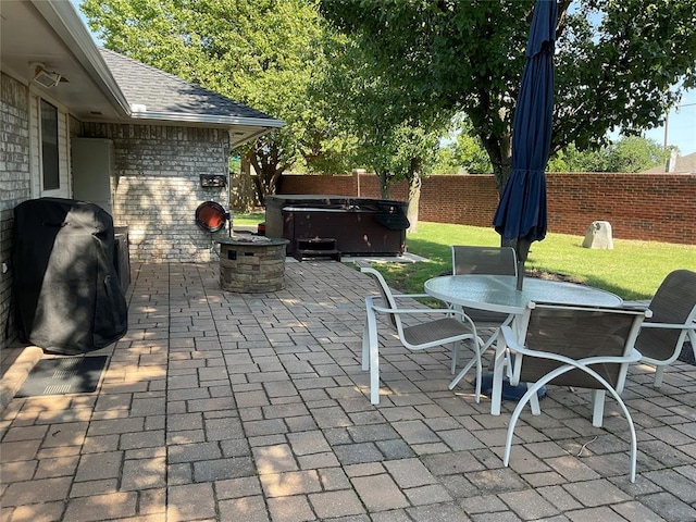 10201 Pinckney Ct, Oklahoma City, OK 73162 - fenced backyard with a hot tub, a patio, and outdoor dining space