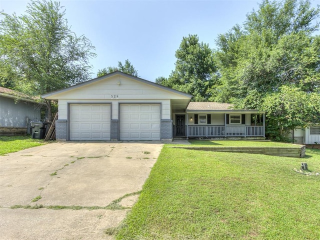 528 Sweetbough St, Jones, OK 73049 - ranch-style house featuring a porch, driveway, an attached garage, a front yard, and brick siding