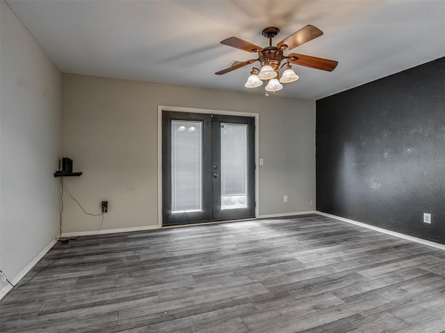 528 Sweetbough St, Jones, OK 73049 - empty room with french doors, ceiling fan, and wood finished floors