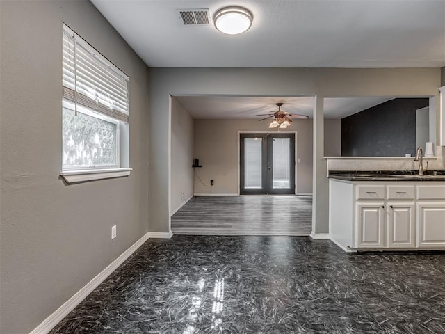 528 Sweetbough St, Jones, OK 73049 - kitchen featuring dark countertops, ceiling fan, french doors, white cabinetry, and open floor plan