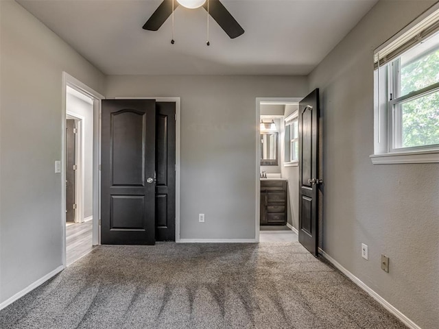 528 Sweetbough St, Jones, OK 73049 - unfurnished bedroom featuring carpet flooring, a ceiling fan, and connected bathroom