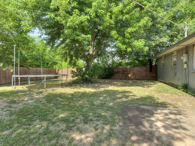 528 Sweetbough St, Jones, OK 73049 - fenced backyard with a trampoline