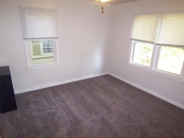 419 W Pulaski St, Shawnee, OK 74804 - carpeted empty room with baseboards
