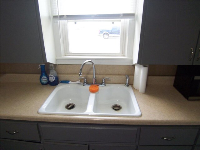 419 W Pulaski St, Shawnee, OK 74804 - kitchen view of gray cabinetry and light countertops