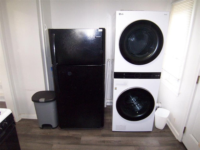 419 W Pulaski St, Shawnee, OK 74804 - laundry area with stacked washer and clothes dryer and wood finished floors
