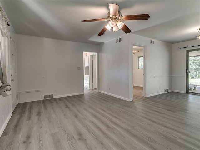 2632 SW 55th St, Oklahoma City, OK 73119 - unfurnished living room featuring ceiling fan and wood finished floors