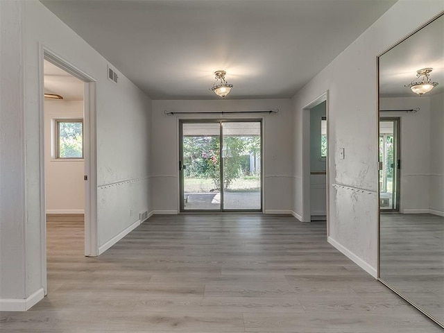 2632 SW 55th St, Oklahoma City, OK 73119 - unfurnished dining area with plenty of natural light and light wood-style floors