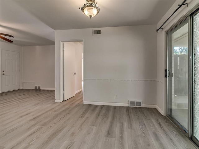 2632 SW 55th St, Oklahoma City, OK 73119 - spare room featuring light wood-style floors and a ceiling fan
