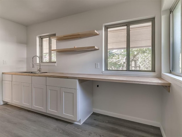 2632 SW 55th St, Oklahoma City, OK 73119 - kitchen with wood counters, dark wood finished floors, and white cabinets